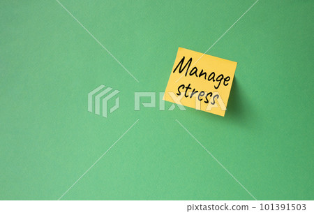 Manage stress symbol. Concept word Manage stress on orange steaky note. Beautiful green background. Business and Manage stress concept. Copy space 101391503