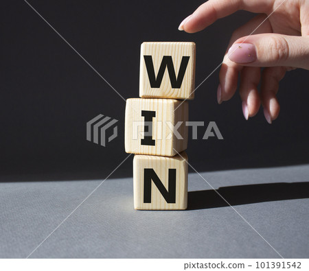 Win symbol. Wooden blocks with words Win. Beautiful grey background. Business and Win concept. Copy space. 101391542
