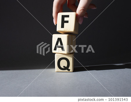 FAQ - Frequently Asked Questions symbol. Concept word FAQ on wooden cubes. Businessman hand. Beautiful grey background. Business and FAQ concept. Copy space. FAQ - Frequently Asked Questions symbol. Concept word FAQ on wooden cubes. Businessman hand. Beautiful grey background. Business and FAQ concept. Copy space. 101391543