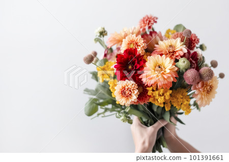 Female hand holds beautiful bouquet of dahlias and chrysanthemums. Mothers day, holiday decor, Flower delivery concept. Generative AI illustration 101391661