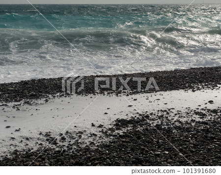 Pebble beach of Nice, France with azure waves of mediterranean sea 101391680