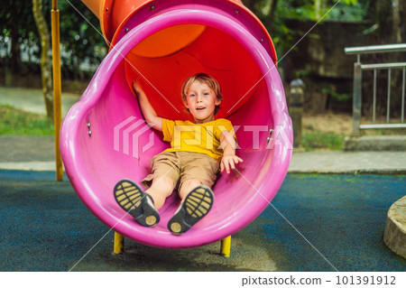 Funny cute happy baby playing on the playground. The emotion of happiness, fun, joy Funny cute happy baby playing on the playground. The emotion of happiness, fun, joy 101391912