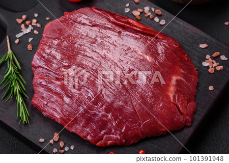 Fresh raw beef with salt, spices and herbs Fresh raw beef with salt, spices and herbs 101391948