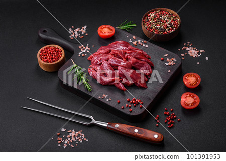 Fresh raw beef with salt, spices and herbs 101391953