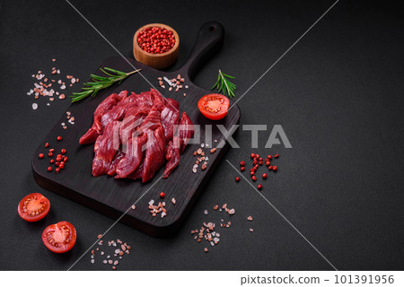 Fresh raw beef with salt, spices and herbs Fresh raw beef with salt, spices and herbs 101391956