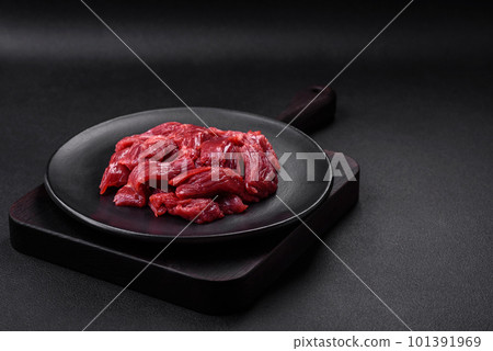 Fresh raw beef with salt, spices and herbs 101391969