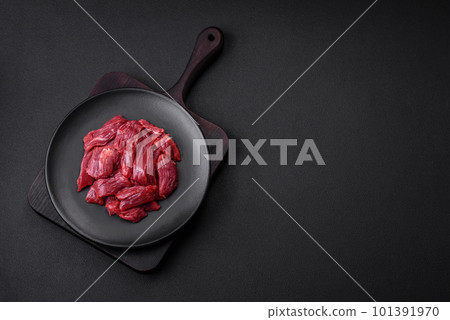 Fresh raw beef with salt, spices and herbs 101391970
