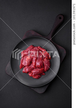 Fresh raw beef with salt, spices and herbs Fresh raw beef with salt, spices and herbs 101391971