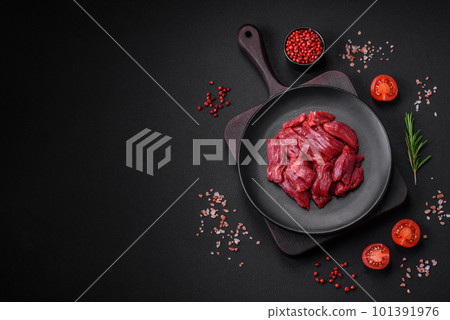 Fresh raw beef with salt, spices and herbs 101391976