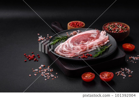 Fresh raw bacon sliced with spices and herbs 101392004