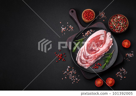 Fresh raw bacon sliced with spices and herbs 101392005