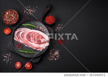 Fresh raw bacon sliced with spices and herbs 101392011