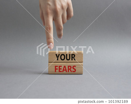 Your fears symbol. Wooden blocks with words Your fears. Beautiful grey background. Businessman hand. Business and Your fears concept. Copy space. 101392189