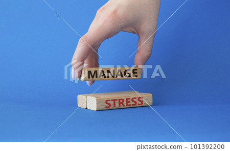 Manage stress symbol. Concept word Manage stress on wooden blocks. Beautiful blue background. Doctor hand. Business and Manage stress concept. Copy space 101392200