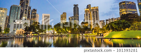 Lake in the evening, near by Twin Towers with city on background. Kuala Lumpur, Malaysia BANNER, LONG FORMAT Lake in the evening, near by Twin Towers with city on background. Kuala Lumpur, Malaysia BANNER, LONG FORMAT 101393281