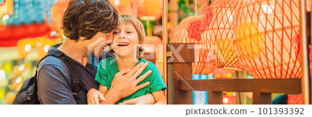 Dad and son celebrate Chinese New Year look at Chinese red lanterns BANNER, LONG FORMAT Dad and son celebrate Chinese New Year look at Chinese red lanterns BANNER, LONG FORMAT 101393392
