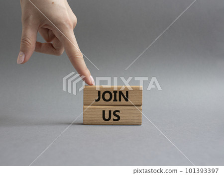 Join us symbol. Concept word Join us on wooden blocks. Beautiful grey background. Businessman hand. Business and Join us concept. Copy space 101393397