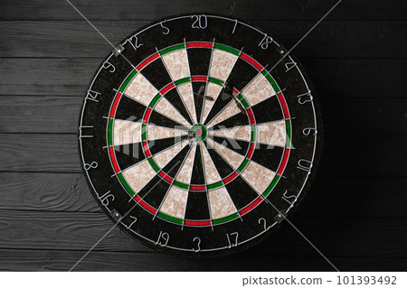 Three darts hit the dartboard. Lucky - one of the darts hits the bull's eye. The concept of winning Three darts hit the dartboard. Lucky - one of the darts hits the bull's eye. The concept of winning 101393492
