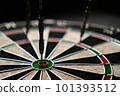 Three darts hit the dartboard. Lucky - one of the darts hits the bull's eye. The concept of winning 101393512