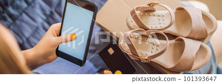 young woman received online shopping parcel opening boxes and buying fashion items by using credit card BANNER, LONG FORMAT young woman received online shopping parcel opening boxes and buying fashion items by using credit card BANNER, LONG FORMAT 101393647