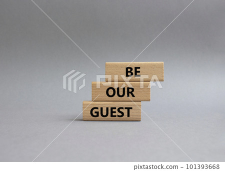 Be our guest symbol. Concept word Be our guest on wooden blocks. Beautiful grey background. Business and Be our guest concept. Copy space 101393668