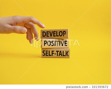 Develop positive self-talk symbol. Concept words Develop positive self-talk on wooden blocks. Beautiful yellow background. Businessman hand. Business and Develop positive self-talk concept. Copy space Develop positive self-talk symbol. Concept words Develop positive self-talk on wooden blocks. Beautiful yellow background. Businessman hand. Business and Develop positive self-talk concept. Copy space 101393672