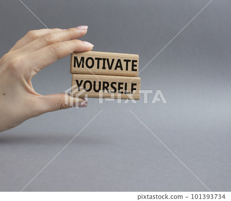 Motivation symbol. Concept words 'Motivate yourself' on wooden blocks. Beautiful grey background. Businessman hand. Business and Motivate yourself concept. Copy space. Motivation symbol. Concept words 'Motivate yourself' on wooden blocks. Beautiful grey background. Businessman hand. Business and Motivate yourself concept. Copy space. 101393734