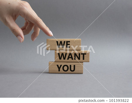 We want you symbol. Concept words We want you on wooden blocks. Beautiful grey background. Businessman hand. Business and We want you concept. Copy space. 101393822