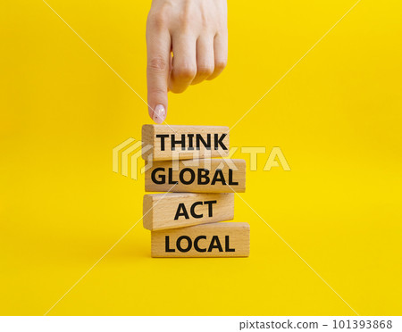 Think global act local symbol. Wooden blocks with words Think global act local. Beautiful yellow background. Businessman hand. Business and Think global act local concept. Copy space. 101393868