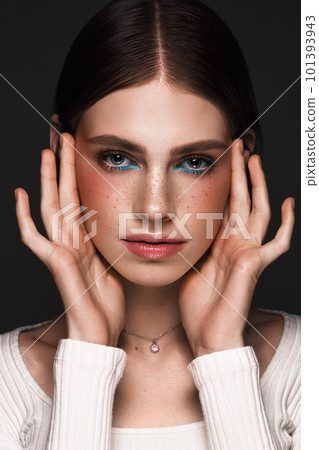 Beautiful girl with creative colorful makeup. Beauty face. 101393943