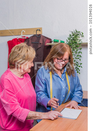 fabric fashion designer measure for patternmaker handmade clothes. mature latin woman and senior 101394016