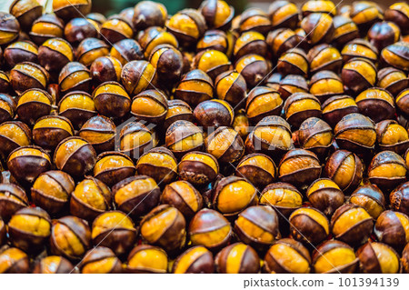 Bunch of roasted chestnuts at street wendor. Roasted Chestnuts, Street Food Bunch of roasted chestnuts at street wendor. Roasted Chestnuts, Street Food 101394139