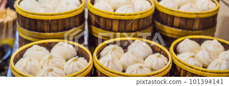 Street food booth selling Chinese specialty Steamed Dumplings in Beijing, China BANNER, LONG FORMAT 101394141