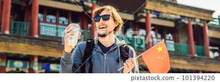 Enjoying vacation in China. Young man with national chinese flag on the background of the old Chinese street. Travel to China concept. Visa free transit 72 hours, 144 hours in China BANNER, LONG 101394220