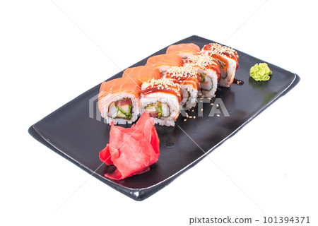 Japanese seafood Sushi roll isolated on white close up. Japanese food restaurant, sushi maki gunkan roll plate or platter set. Maki Sushi rolls with salmon and avocado. Sushi isolated at white 101394371