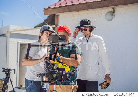camera operator, director and dp discuss the process of a commercial video shoot camera operator, director and dp discuss the process of a commercial video shoot 101394444