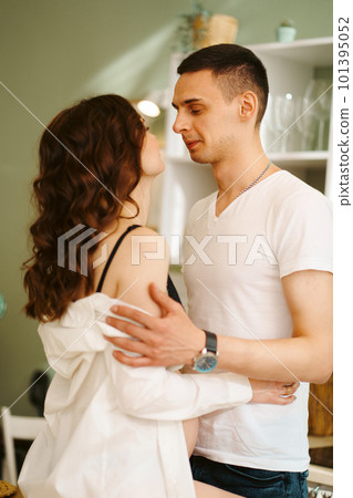 happy and in love man and pregnant woman in black underwear. 101395052