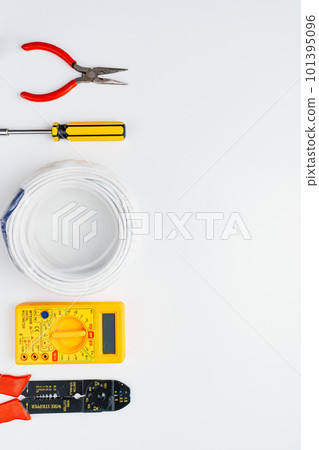 Stripper, Pliers, Multimeter, Wire and Screwdriver on a white background 101395096