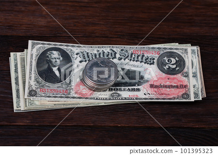 Old west period US banknotes and silver certificates with silver dollar coins 101395323