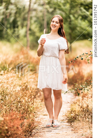 Young woman enjoy nature in autumn season. Lifestyle female portrait elegance retro fashion Young woman enjoy nature in autumn season. Lifestyle female portrait elegance retro fashion 101395742