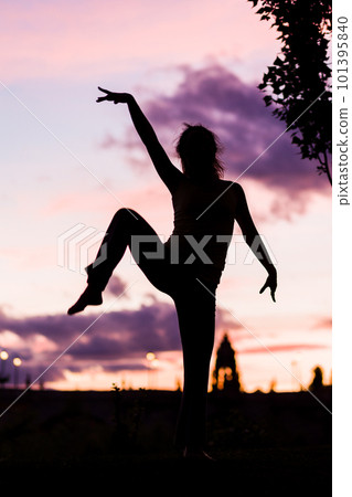 silhouette from a ballet dancer during the dusk or sunset happy positive motion with music silhouette from a ballet dancer during the dusk or sunset happy positive motion with music 101395840