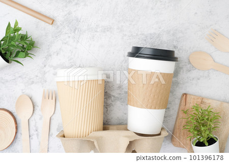The biodegradable coffee cup with and cup holder. Recycled and sustainable to-go or take-away package for food and drink packaging. 101396178