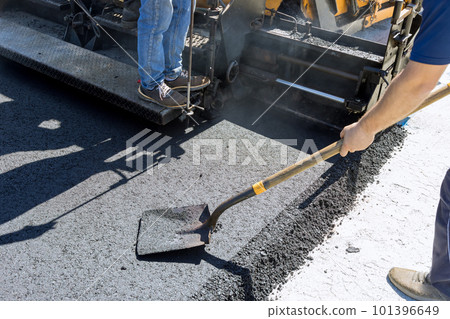 Asphalt paver machine and steam road roller during road construction works, placing layer process of new road 101396649