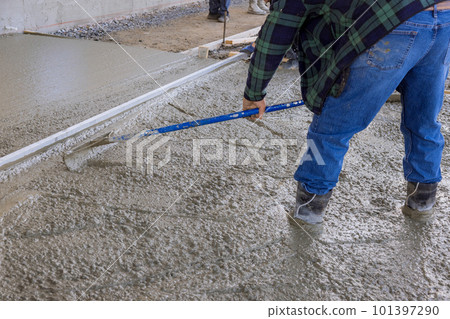 Wet concreting process requires skilled laborers to pour concrete with precision. 101397290