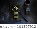 Persimmon leaf sushi 101397912