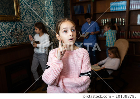 Pensive girl trying to find solution of conundrum to get out of room 101398783