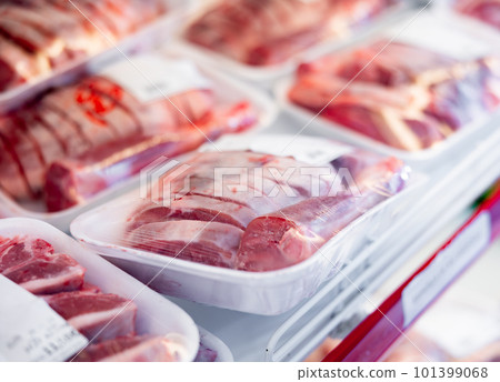 Fresh raw lamb packed in plastic trays in butcher shop 101399068