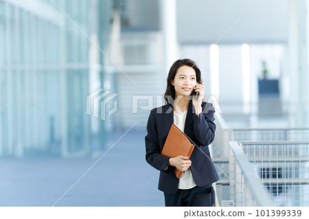 Young business woman with a smartphone 101399339
