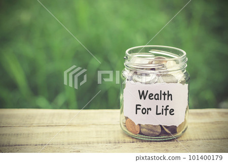 Money in the jar on wooden table Money in the jar on wooden table 101400179