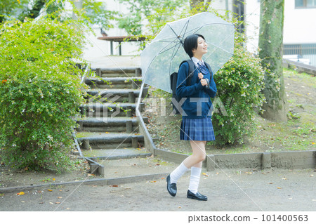 School girls with umbrella 101400563